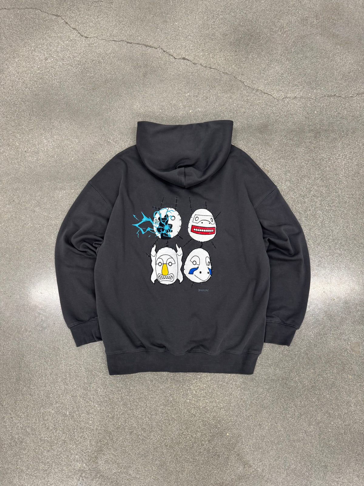 Copy Ninja Killshot dark gray hoodie laid flat, back view with embroidered Kakuzu masks and Kakashi's Raikiri