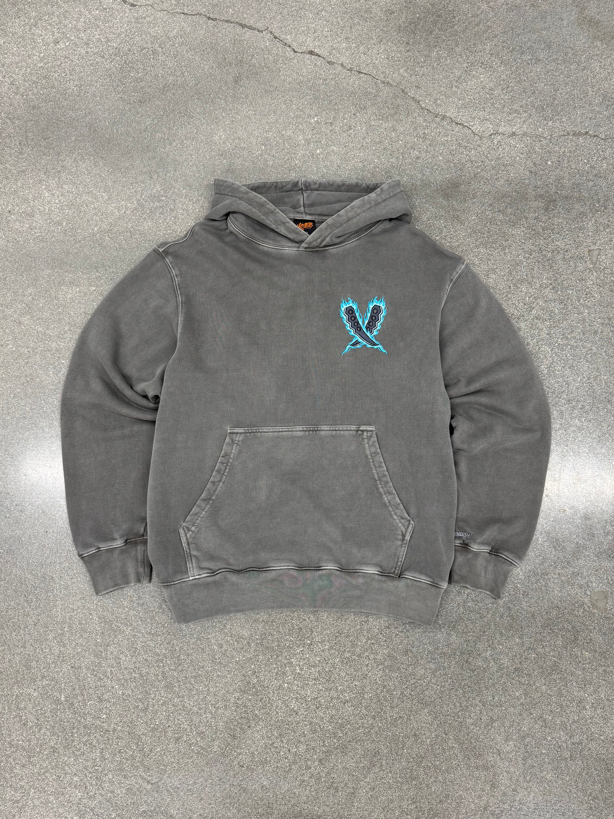 Legacy of the Flame gray hoodie laid flat, front view with Asuma's crossed chakra blades embroidered on the chest