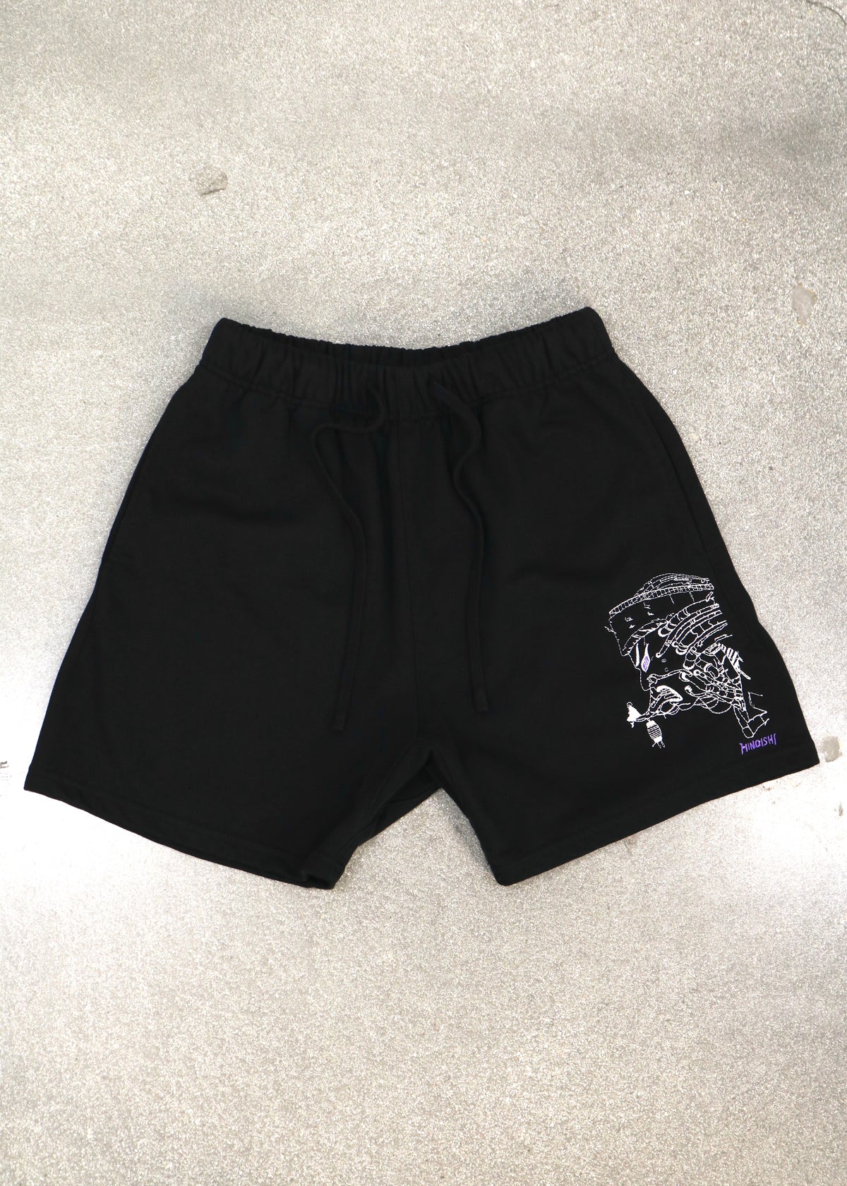 Pain-Amegakure Deity black shorts laid flat, front view with embroidered Pain and Amegakure on the leg